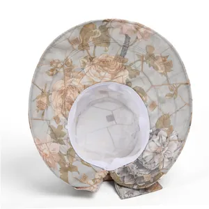 Detail of breathable mesh lining and elegant floral print on sun hat for women