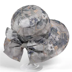 Women's wide brim sun hat with grey floral pattern and golden embroidery decoration