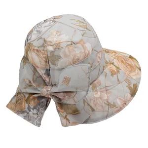 Women's wide brim floral sun hat with a large decorative bow and breathable mesh fabric