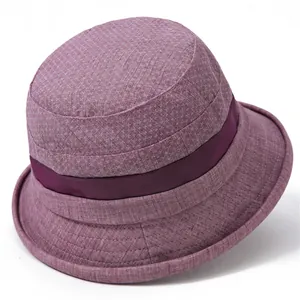 Detail of purple textured cotton bucket hat showing fine plaid fabric and ribbon trim