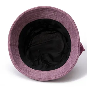Detail view of purple sun hat showing black inner lining and comfortable sweatband