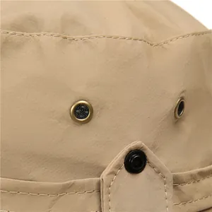 Detail showing metal mesh vents and reinforced stitching on a khaki sun hat