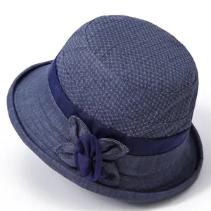 Navy blue breathable cotton sun hat for elderly women with decorative floral accent