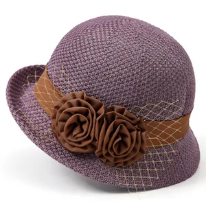 Elegant purple woven sun hat for women with brown floral ribbon and gold mesh veil