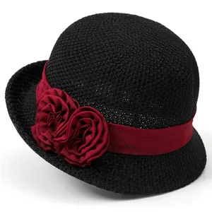 Elegant black woven cloche hat with dark red ribbon and two decorative fabric roses