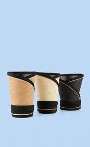 Three foldable straw sun visors in khaki, cream, and black with flexible roll-up design