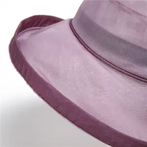 Detail of elegant purple sun hat showing breathable mesh texture and reinforced brim