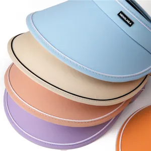 Detailed stack of UPF50+ sun hats in light blue, beige, pink, and purple fabric colors