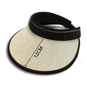 Detail view of the 12cm wide woven brim and metal G logo on a women's sun visor hat