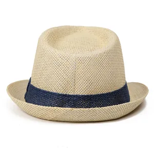 Close-up of the breathable straw weave texture and blue ribbon on the elderly men's hat