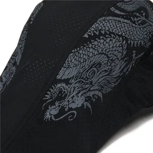 Close-up of breathable mesh fabric on sport cap with detailed silver dragon print