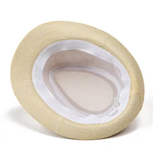 Detail view of woven paper hat interior showing size 58 label and white sweatband