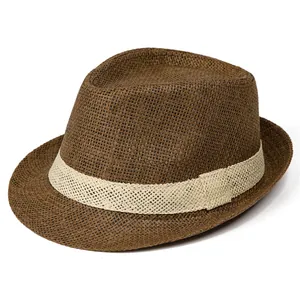 Macro view of breathable brown straw fedora with cream woven band and fine texture