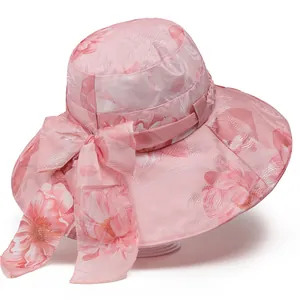 Elegant pink floral sun hat for women featuring a wide brim and decorative bow accent
