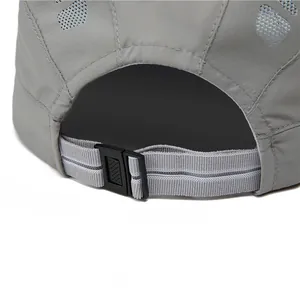 Detail of adjustable quick-dry hat with breathable mesh and buckle strap in grey
