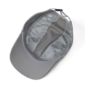 Detail view of the breathable mesh interior and adjustable plastic back strap of the cap
