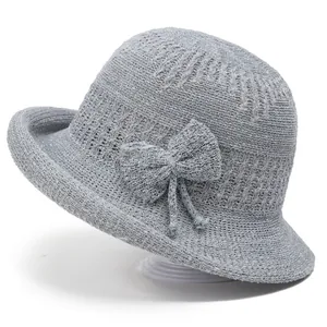 Breathable gray knitted sun hat with bow decoration and shimmering metallic texture