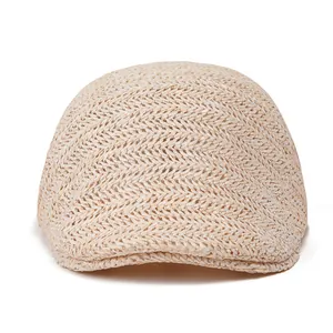 Detail of herringbone weave texture on a beige straw flat cap for men and women