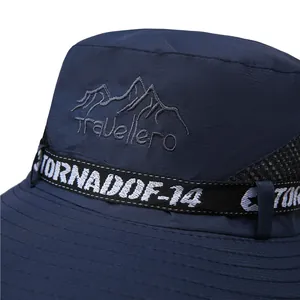 Detail of navy blue sun hat featuring Travellero embroidery and breathable mesh side vents