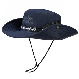 Detail of dark blue sun hat featuring breathable mesh, mountain embroidery and wind cord