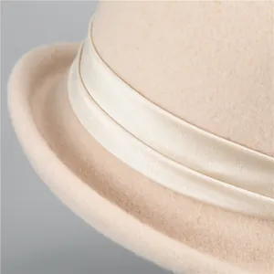 Elegant beige wool felt cloche hat with silk ribbon trim and French vintage curved brim