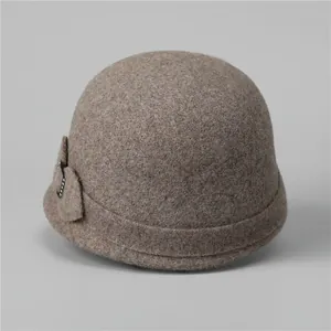 Close-up of wool fedora hat featuring a side bow with sparkling rhinestone details