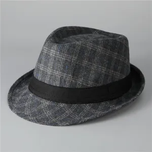 Detail of grey plaid fedora hat with black grosgrain ribbon for men's winter fashion