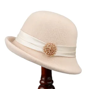 Vintage beige wool cloche hat for women featuring a satin ribbon and crystal ornament
