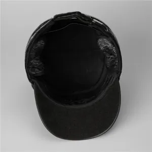 Close-up of winter hat's warm grey faux fur ear flaps and thick black inner lining