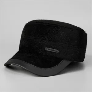 Close-up of black plush flat top hat with faux fur texture and leather-wrapped brim edge