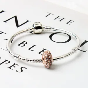 Silver snake chain bracelet with rose gold pavé charm and shimmering cubic zirconia stones