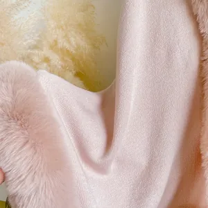 Elegant pink knit poncho shawl with soft faux rabbit fur trim for autumn and winter