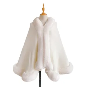 Elegant cream knit cape coat featuring plush faux rabbit fur trim for autumn and winter wear