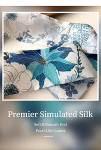Macro shot of faux silk scarf showing delicate blue floral print and smooth twill texture