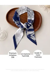 Detail of blue paisley silk twill skinny scarf showing the high-density 12 momme fabric