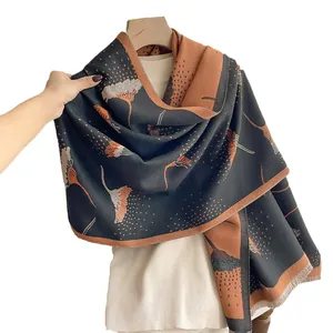 Thick cashmere-like scarf with dandelion pattern and tassel edge in black and caramel