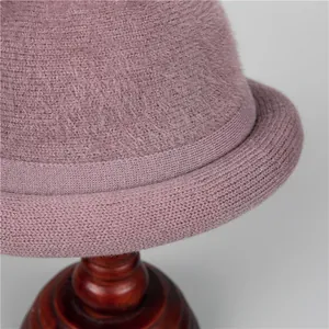 Close-up of plush mauve knitted cloche hat showing thick thermal mohair texture