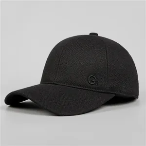 Classic black winter baseball cap for men featuring warm ear flaps and G embroidery