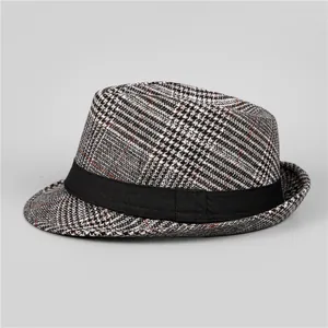 Close-up of classic houndstooth fedora hat with black grosgrain band for men