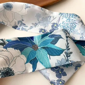 Elegant floral print skinny silk scarf in blue and cream colors for women neck styling