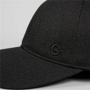 Close-up of black wool blend baseball cap showing detailed G letter embroidery