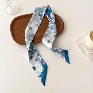 Floral skinny silk scarf with blue and white flower prints for elegant styling