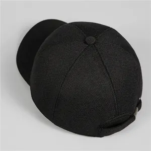 Classic men's black winter baseball cap with ear flaps and thick woven texture fabric