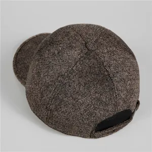 Thick warm dark brown tweed baseball cap for elderly men featuring ear protection flaps