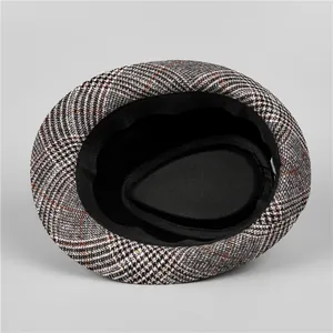 Detail of vintage plaid fedora featuring black inner sweatband and premium fabric lining