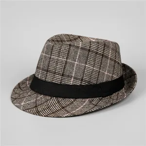 Close-up of classic plaid pattern and black ribbon band on men's felt fedora hat