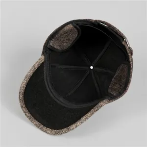 Detailed interior of men's winter hat showing thick warm lining and ear flap structure