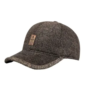 Winter thermal baseball cap for elderly men with warm ear protection and brown tweed texture
