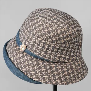 Elegant tweed bucket hat for elderly women with pearl floral accent and denim trim