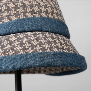 Winter houndstooth bucket hat for elderly women with knitted texture and blue trim